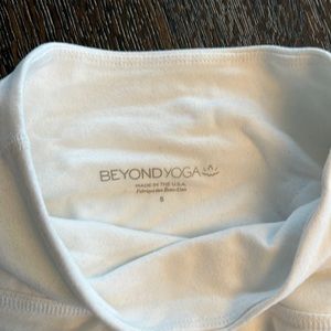 White Beyond Yoga mid rise leggings.